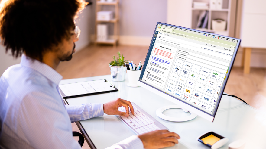 man in scrolling on a desktop computer with bearbuy on the screen