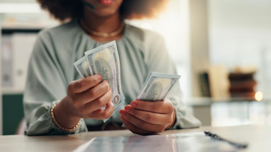 person_counting_cash_with_hands