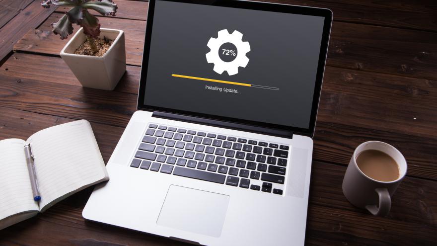 laptop with gear symbol on screen