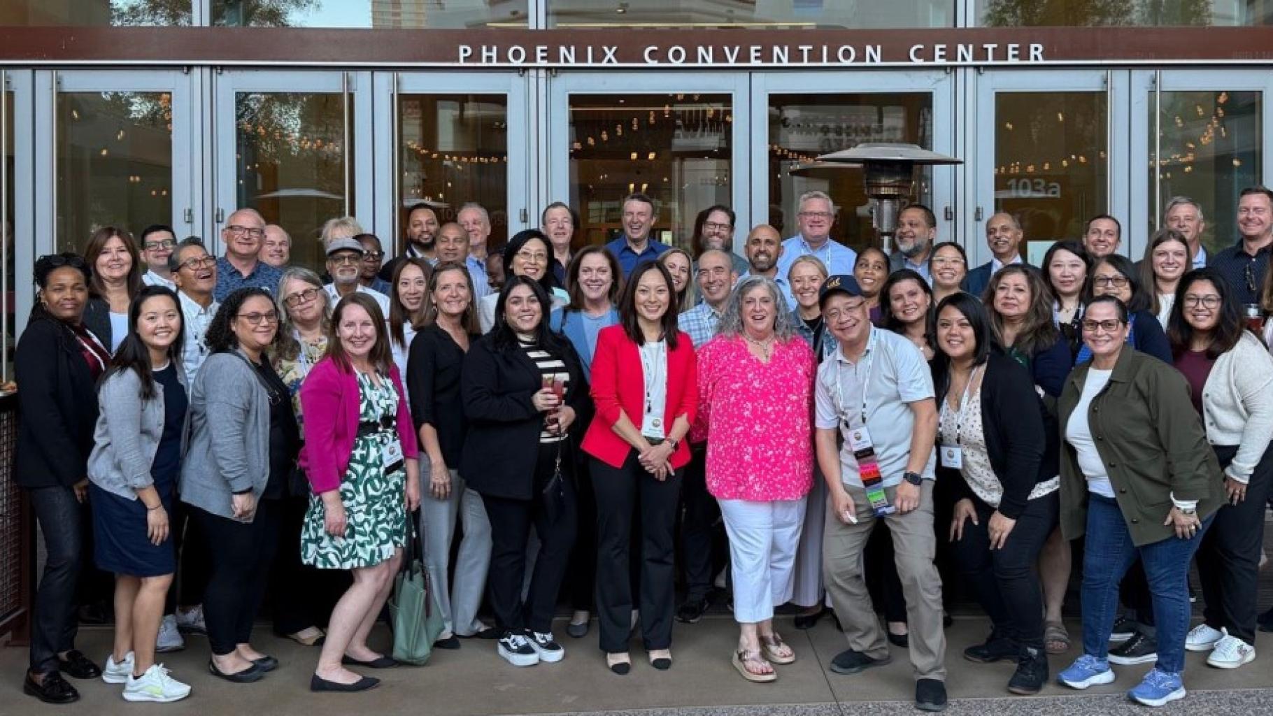 large group of people in front of phoenix convention center