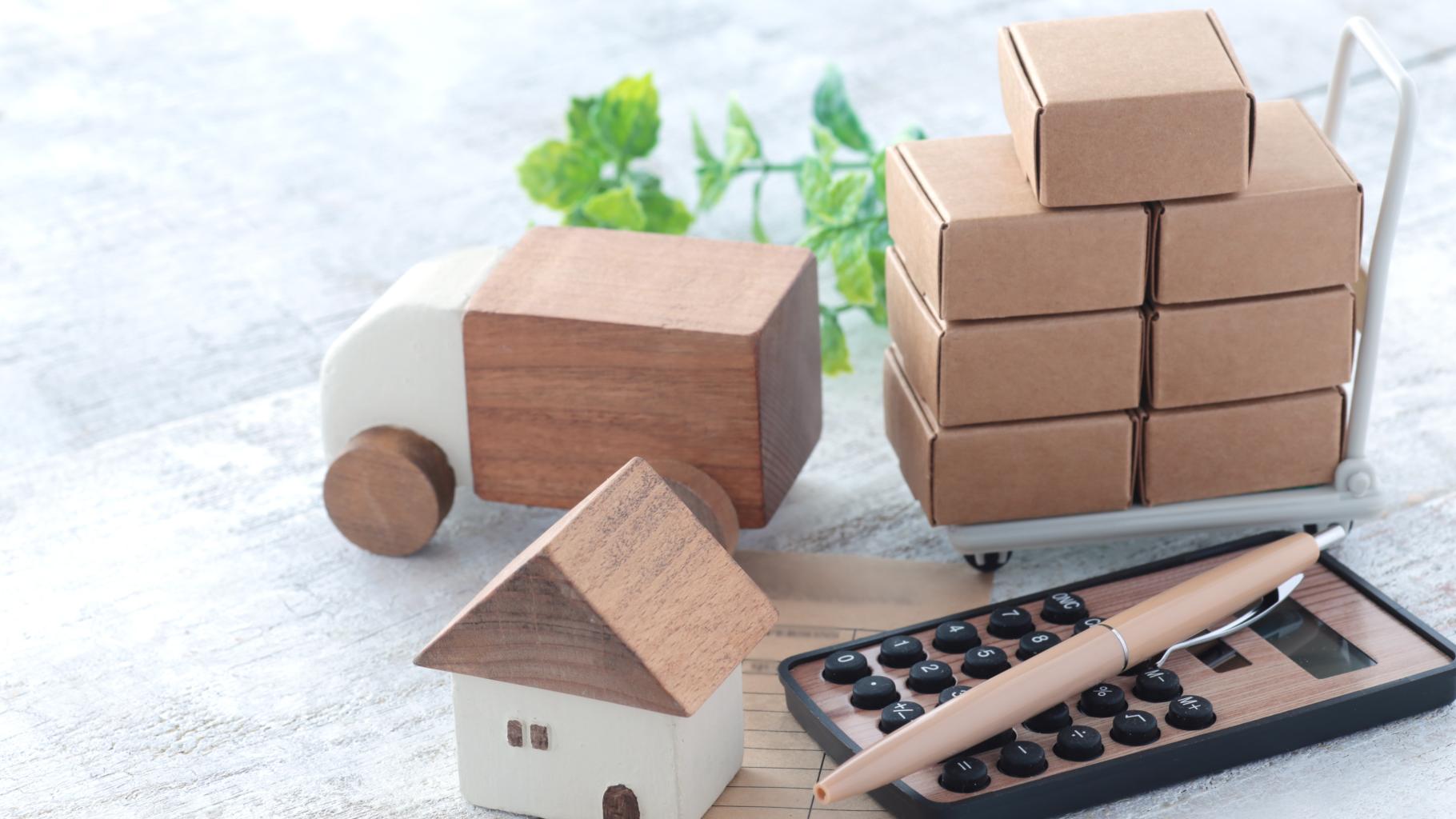 boxes, toy house, and calculator